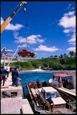 Cars on a barge at Alofi wharf, Niue