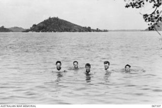SINGAPORE, STRAITS SETTLEMENTS, 1943-09. SOME OF THE MEMBERS OF "OPERATION JAYWICK", "Z" SPECIAL UNIT, AUSTRALIAN SERVICES RECONNAISSANCE DEPARTMENT, BATHING AT PALAU BULAT, A SMALL UNINHABITED ..