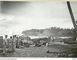 SAMPUN, NEW BRITAIN. 1945-01-27. TROOPS OF THE 6TH FIELD AMBULANCE LOADING SUPPLIES AND EQUIPMENT ON TO AN LCM (LANDING CRAFT MECHANISED) FOR THE LANDING AT KEIP PLANTATION BY TROOPS OF THE 14/32ND ..