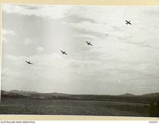 Papua, New Guinea. 1942-08. American Curtiss P40 Kittyhawk aircraft flying in formation over New Guinea