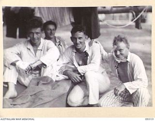 SORAKEN AREA, BOUGAINVILLE, 1945-06-12. WOUNDED MEMBERS OF 31/51 INFANTRY BATTALION WAITING AT THE MAIN DRESSING STATION PRIOR TO BEING TAKEN ON BOARD THE HOSPITAL SHIP STRADBROKE. IDENTIFIED ..