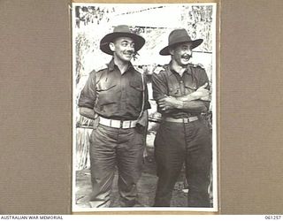 KUMBARUM, NEW GUINEA. 1943-11-14. LIEUTENANT COLONEL WENTWORTH SHIELDS (LEFT) AND LIEUTENANT COLONEL ANDREWS (RIGHT) MEMBERS OF THE BRITISH MILITARY MISSION TO AUSTRALIA LED BY MAJOR GENERAL J. S. ..