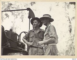 CAPE CUNNINGHAM, NEW BRITAIN, 1944-12-16. MAJOR E MCD WALKER (DEPUTY COMMANDER, ROYAL ENGINEERS), (2), WITH LIEUTENANT B T LIPSCOMBE, (1), AT THE 2/2 FORESTRY COY MILL SITE
