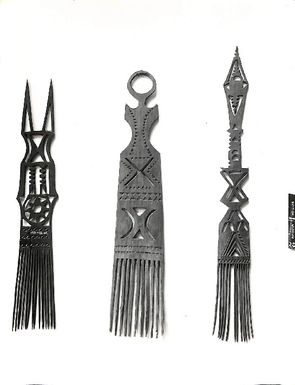 Photo of three combs with elaborately carved handles. (V28)