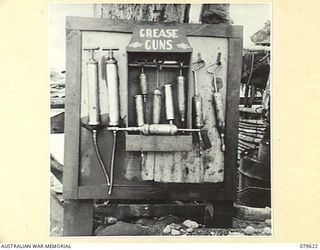 ORO BAY, NEW GUINEA. 1943-07. GREASE GUNS AT THE UNIT WORKSHOP OF THE 10TH FIELD AMBULANCE, ARMY MEDICAL CORPS