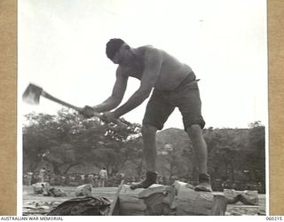 ELA BEACH, NEW GUINEA. 1943-11-13. VX66744 GUNNER A. HUNT OF THE 2ND AUSTRALIAN FIELD REGIMENT, WINNER OF THE 12 INCH UNDERHAND WOODCUT AT THE COMBINED SERVICES SPORTS MEETING