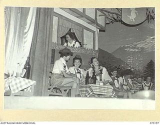 LAE, NEW GUINEA. 1944-08-11. THE PATRONS OF "THE WHITE HORSE INN" MAKE A COLOURFUL SCENE DURING THE PLAY STAGED BY THE WHITE HORSE INN CONCERT PARTY FOR THE PATIENTS OF THE 113TH CONVALESCENT ..