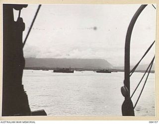 TOROKINA AREA, BOUGAINVILLE, SOLOMON ISLANDS. 1944-12-06. HMAS KANIMBLA, (LEFT), AND HMAS MANOORA, (RIGHT), IN EMPRESS AUGUSTA BAY VIEWED FROM HMAS WESTRALIA