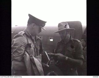 7 MILE, NEW GUINEA. 1943-11-01. THE ARRIVAL BY AIRCRAFT OF THE FIRST PARTY OF THE UNITED KINGDOM LETHBRIDGE MILITARY MISSION AT WARDS 'DROME. SHOWN: LIEUTENANT COLONEL C. BRISCOE (LEFT) AND ..