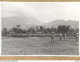 17 MILE, PORT MORESBY AREA, 1943-12-24. TROOPS OF THE 10TH AUSTRALIAN ADVANCED ORDNANCE DEPOT ON PARADE FOR AN INSPECTION BY VX247 BRIGADIER C. A. STINSON, DEPUTY DIRECTOR OF ORDNANCE SERVICES, ..