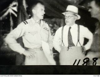 AITAPE, NORTH EAST NEW GUINEA. C. 1944-06. AT HEADQUARTERS NO. 10 GROUP RAAF, LEFT TO RIGHT: AIR COMMODORE F. R. W. SCHERGER, THE AIR OFFICER COMMANDING NO. 10 GROUP RAAF, ARTHUR DRAKEFORD, THE ..