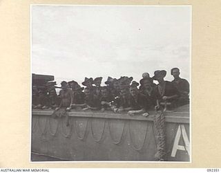 GAZELLE PENINSULA, NEW BRITAIN, 1945-05-15. TROOPS OF A COMPANY, 37/52 INFANTRY BATTALION, ABOARD A LANDING CRAFT DURING EMBARKATION FOR WATU PLANTATION. THE MEN HAD MARCHED ACROSS THE GAZELLE ..
