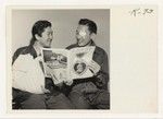 In the public relations office of Dibble General Hospital, at Menlo Park, Palo Alto, California, are shown PFC Walter Heirakuji