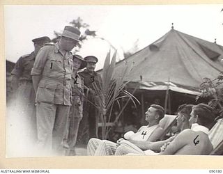 JACQUINOT BAY, NEW BRITAIN. 1945-03-29. LORD WAKEHURST, GOVERNOR OF NEW SOUTH WALES (1), ACCOMPANIED BY SISTER M.M. WILSON, AUSTRALIAN ARMY NURSING SERVICE (2), AND LIEUTENANT R.F.J. STAFFORD (3), ..