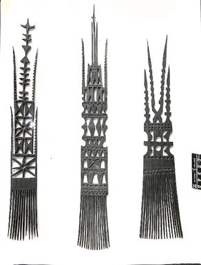 Photo of three combs with elaborately carved handles (V26)