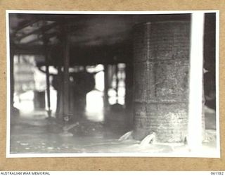 17 MILE, PORT MORESBY AREA, NEW GUINEA. 1943-12-04. DIRTY WATER BEING RUN AWAY FROM THE WASHING MACHINES AT THE 9TH AUSTRALIAN DIVISION MOBILE LAUNDRY