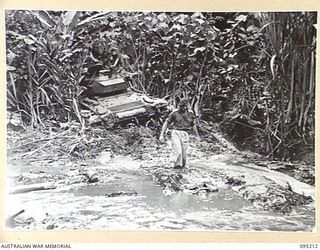 TOROKINA AREA, BOUGAINVILLE, 1945-08-14. AN M24 LIGHT TANK BELLIED IN MUD ON THE BANK OF A CREEK DURING TESTS CONDUCTED BY THE BRITISH WAR OFFICE TRIALS TEAM (TANKS)