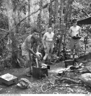 PAPUA, NEW GUINEA. 1942-10. WASHING DAY FOR PRESS CORRESPONDENTS AT THEIR CAMP IN THE IORIBAIWA RIDGE AREA