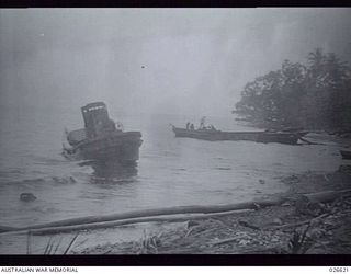 MILNE BAY, PAPUA, 1942-09. TWO BARGES, USED BY THE JAPANESE IN THEIR UNSUCCESSFUL ATTEMPT TO LAND AT MILNE BAY, RIDDLED BY GUN FIRE FROM KITTYHAWK FIGHTER PLANES OF AN AUSTRALIAN SQUADRON