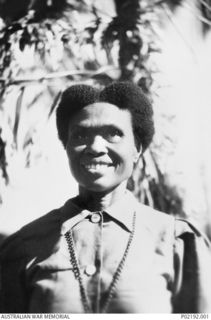 Ahioma, New Guinea, 1942-09. Portrait of Maiogara, a mission trained nurse, who was awarded the Loyal Service Medal, presented by Major General Basil Morris, General Officer Commanding, Australian ..