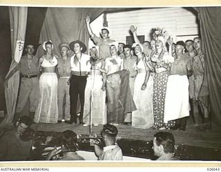 PAPUA, NEW GUINEA. 1942-07. A CONCERT PARTY WAS FORMED FROM AMONG THE TROOPS OF AN AUSTRALIAN INFANTRY BRIGADE SERVING IN THE AREA FOR THE ENTERTAINMENT OF AUSTRALIAN AND AMERICAN TROOPS IN PAPUA. ..