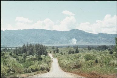 The road from Mt Hagen to Minj. People are moving down from the hills to build their houses along it (1) : Wahgi Valley, Papua New Guinea, 1970 / Terence and Margaret Spencer