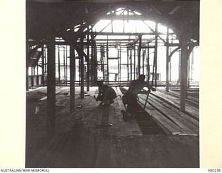 ALEXISHAFEN, NEW GUINEA. 1944-07. 4TH FIELD COMPANY, ROYAL AUSTRALIAN ENGINEERS, LAYING THE FLOORING IN THE UPPER STOREY OF THE PRIEST'S RESIDENCE IN THE MISSION AT SOUTH ALEXISHAFEN. THE BUILDING, ..