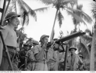 KIRIWINA, TROBRIAND ISLANDS, PAPUA. 1944-01-31. IN MODERN WARFARE, AERODROME DEFENCE IS VITAL AND THE RAAF HAS TRAINED A NUMBER OF "TOUGH GUYS" TO LOOK AFTER ITS POSSESSIONS. CORPORAL G. D. SMITH, ..