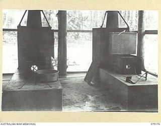 BOUGAINVILLE ISLAND. 1945-02-22. PRESSURE FUEL BURNER FITTED TO FOWLER STOVES IN OPERATION. THESE UNITS WERE DESINGED AND MADE BY PERSONNEL OF THE 113TH FIELD PARK WORKSHOPS, 3RD DIVISION