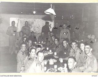 LAE, NEW GUINEA. 1944-08-17. MEMBERS OF THE WHITE HORSE INN CONCERT PARTY BEING ENTERTAINED AT NO. 3 SERGEANTS MESS, HEADQUARTERS, NEW GUINEA FORCE AFTER THE SHOW. THE CONCERT PARTY CONSISTS OF ..