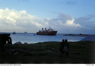 Local supply ship arriving at Pangi wharf, Lifuka Island.  This image relates to the service of Michael Church, 17 Construction Squadron, who was a member of the Cyclone Isaac mission in 1982, in ..