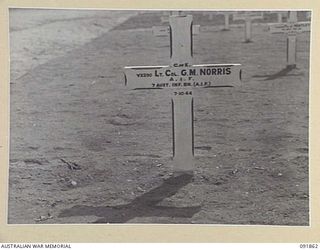 TOROKINA, BOUGAINVILLE. 1945-05-14. THE GRAVE OF LIEUTENANT COLONEL G.M. NORRIS, 7 INFANTRY BATTALION, AT THE AUSTRALIAN WAR CEMETERY. THE PHOTOGRAPH WAS REQUESTED FOR GENERAL OFFICER COMMANDING 2 ..