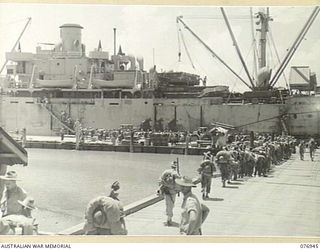 LAE, NEW GUINEA. 1944-11-10. TROOPS OF THE 5TH SUB AREA EMBARKING ABOARD THE AMERICAN LIBERTY SHIP "J.STERLING MORTON" FOR JACQUINOT BAY