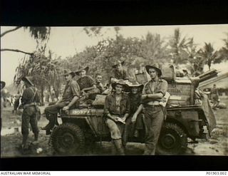 Kelanoa Harbour (near Sio), New Guinea. c. 1944-03. Personnel of No 1 Section, Detached, 2 Field Survey Company awaiting embarkation to Launch Jetty to return to Finschhafen after carrying out ..