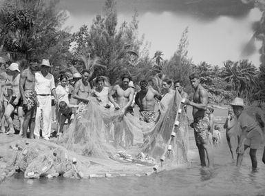 [Pacific Islanders and fishing net with fish]