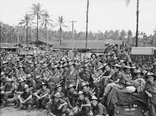 JACQUINOT BAY, NEW BRITAIN. 1945-09-09. TROOPS OF 37/52 INFANTRY BATTALION, WAITING TO EMBARK ON BARGES TO GO OUT TO HMAS MANOORA. THE MANOORA CARRIED TROOPS FOR THE OCCUPATION OF THE RABAUL AREA, ..