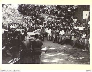 RATONGOR, NEW BRITAIN. 1945-10-10. THE ROYAL PAPUAN CONSTABULARY BAND COMMENCES TO PLAY MUCH TO THE DELIGHT AND AMAZEMENT OF THE YOUNGER CHILDREN. THEY ARE PLAYING AT THE GALA DAY HELD AT THE ..