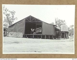 17 MILE, PORT MORESBY AREA, NEW GUINEA. 1943-12-04. EXTERIOR VIEW OF THE 9TH AUSTRALIAN DIVISION MOBILE LAUNDRY. THIS UNIT OPERATES 24 HOURS PER DAY AND HANDLES APPROXIMATELY 8000 ARTICLES EACH ..