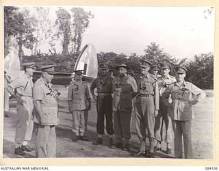 TOROKINA AREA, BOUGAINVILLE. 1944-12-11. GENERAL SIR THOMAS BLAMEY, COMMANDER-IN-CHIEF, ALLIED FORCES, SOUTH WEST PACIFIC AREA, AMONG SENIOR OFFICERS AT AN AIRSTRIP WITHIN HEADQUARTERS 2 CORPS ..