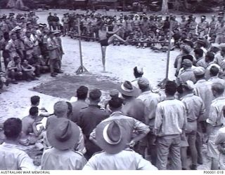 THE SOLOMON ISLANDS, 1945-01-12. A GENERAL VIEW OF THE HIGH JUMP AREA AT A COMBINED ANZAC SPORTS MEETING AT BOUGAINVILLE ISLAND. (RNZAF OFFICIAL PHOTOGRAPH.)