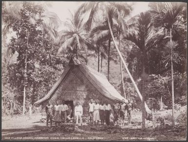 Local people standing outside the village school at Maravari River, Vella Lavella, Solomon Islands, 1906 / J.W. Beattie