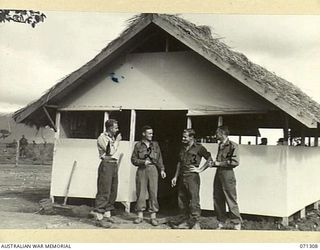 DUMPU, RAMU VALLEY, NEW GUINEA, 1944-03-21. MEMBERS OF THE 9TH FIELD AMBULANCE DETACHMENT, WHO HANDLE MEDICAL EVACUATION BY AIR FROM THE DUMPU AIRSTRIP. IDENTIFIED PERSONNEL ARE: NX117566 SERGEANT ..