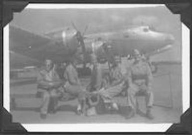 Red Cross workers sit on a tarmac in Australia