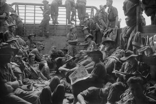 AT SEA, NEW GUINEA. 1944-05-31. MEMBERS OF BATTALION HEADQUARTERS AND B COMPANY 37/52ND INFANTRY BATTALION ABOARD AN AMERICAN LANDING BARGE EN ROUTE FROM NAGADA TO SARANG HARBOUR, A FORWARD BASE ..