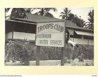 MILNE BAY, NEW GUINEA, 1944-02-12. A PORTION OF THE TROOPS' CLUB ERECTED BY THE AUSTRALIAN ARMY CANTEENS SERVICE. IT OFFERS FACILITIES FOR LETTERWRITING, PLAYING GAMES, AND ALSO GIVES A FREE ..