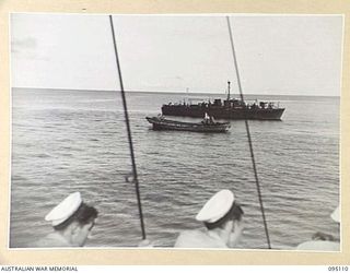 AT SEA, OFF BUIN, BOUGAINVILLE, 1945-08-20. A ROYAL AUSTRALIAN NAVY FAIRMILE STANDING BY WATCHING A JAPANESE BARGE WHICH HAD CONVEYED A MESSENGER FROM LIEUTENANT-GENERAL M. KANDA, COMMANDER ..