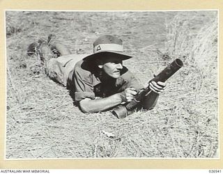 PAPUA, NEW GUINEA. 1942-09-07. A TYPE-89 JAPANESE GRENADE THROWER, OR DISCHARGER, FOR TWO-INCH GRENADES. AS SHOWN IN THE PHOTOGRAPH IT HAS TO BE HELD BY THE LEFT HAND AND PRESSED FIRMLY INTO THE ..