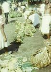 Pineapples, pumpkins, sweet potatoes, bananas offered for sale at Rabaul's twice weekly farmers market, Rabaul, 1964