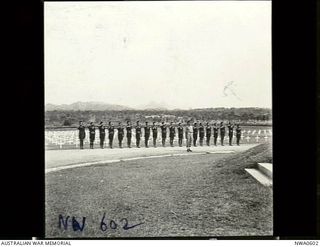 Port Moresby, Papua. 1944-08-05. Buglers of the Royal Papuan Constabulary playing "The Last Post" at the opening of the Bomana War Cemetery