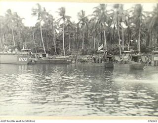 JACQUINOT BAY, NEW BRITAIN. 1944-11-12. LANDING BARGES, LOADED WITH FUEL, DRAWING UP AT THE LANDING POINT OF THE 5TH BASE SUB AREA